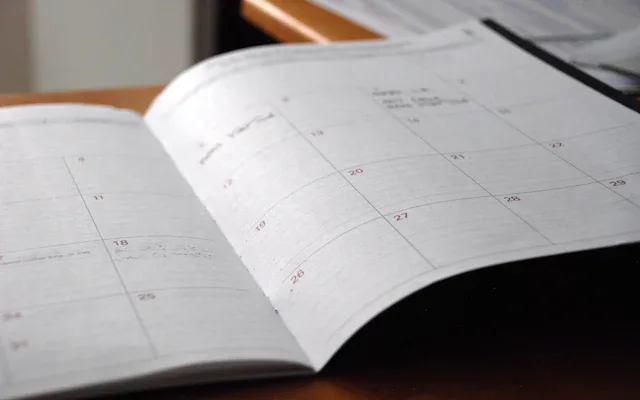 An open monthly planner on a desk
